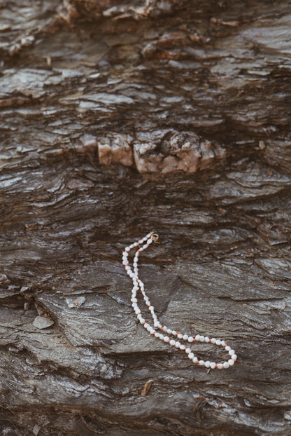 alba necklace on rock closeup 